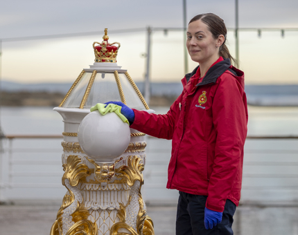 Aiga, Housekeeping, cleaning the Binnacle on the Verandah Deck.