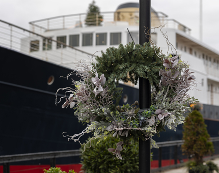 A Christmas wreath hanging on a post outside the ship, Fingal Hotel.