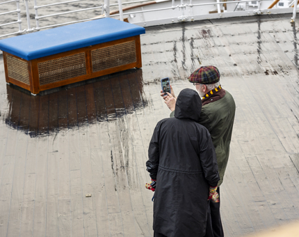 Two visitors taking a selfie on the Verandah Deck. 
