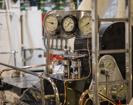 A close-up of dials in the Engine Room. 