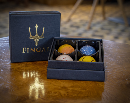A small box of handcrafted chocolates in a Fingal gift box.