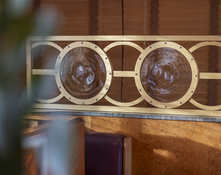 Decorative round glass panels in The Lighthouse Restaurant & Bar.