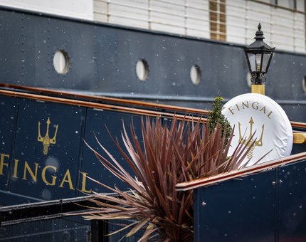 The entrance to Fingal Hotel, it is lightly snowing.