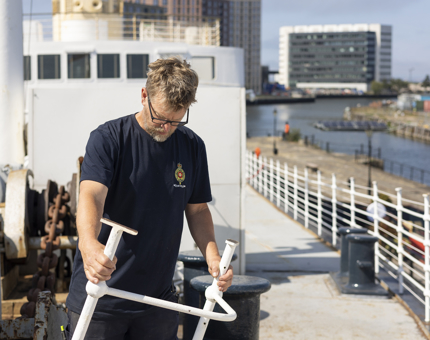 A maintenance team member removing some railings from the decks of Fingal Hotel.