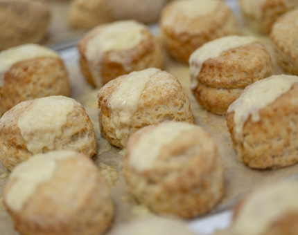 A close up of a tray of cheese scones in the Tearoom Galley. 