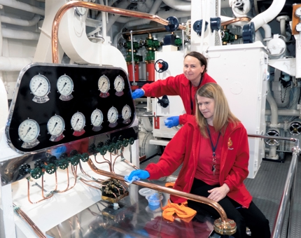 In the Engine Room, Renata and Lynne, Housekeepers, ensure the brass is gleaming.