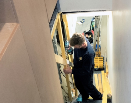 Working in the back of house stairwell aboard Fingal.