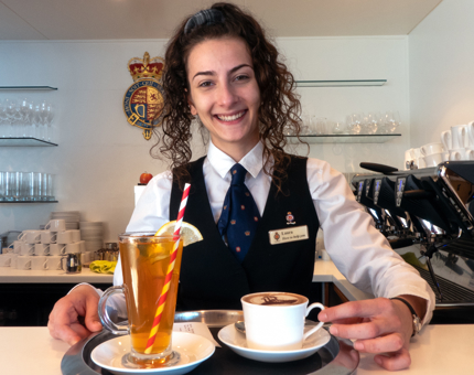 Serving a tray of hot drinks