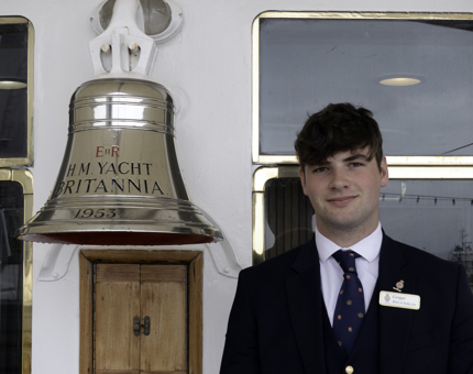 A new Visitor Assistant (man) standing by Britannia's Bell. 