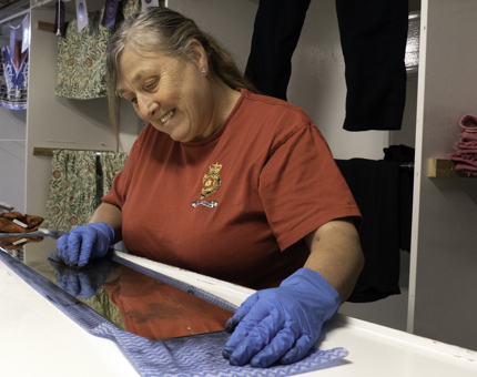 A woman is polishing. 