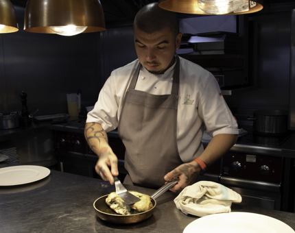Breakfast chef preparing an omelette
