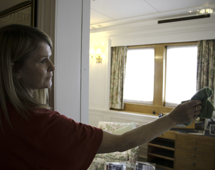 Housekeeper, Lynn, keeping the glass outside The Queen's Sitting Room clear for visitors..jpg