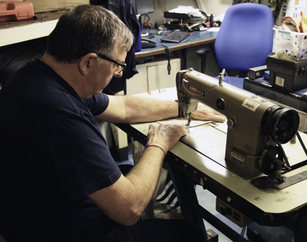 Tony, Maintenance Team Manager, sewing flags..jpg