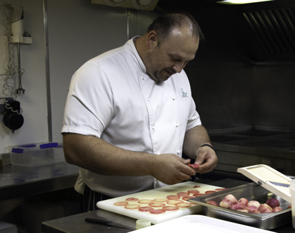 Chef prepares beetroot in the Galley.