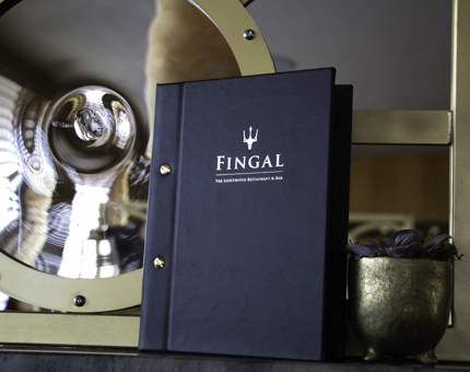 Cover of Fingal menu next to a window and potted plant. 