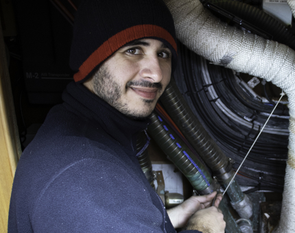 Man carries out pipe maintenance work. 