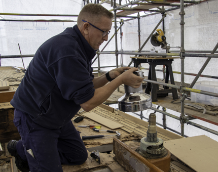 A man from Maintenance removing the Port winch on Bloodhound. 