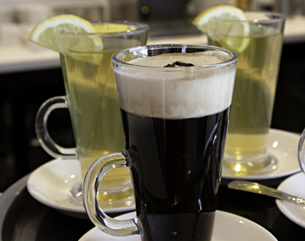 A tray containing hot toddy drinks. 