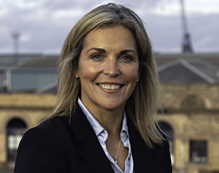 A photo of a woman with shoulder length blonde hair. 