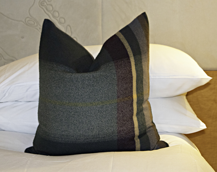 A tartan pillow on a bed in a cabin in Fingal. 