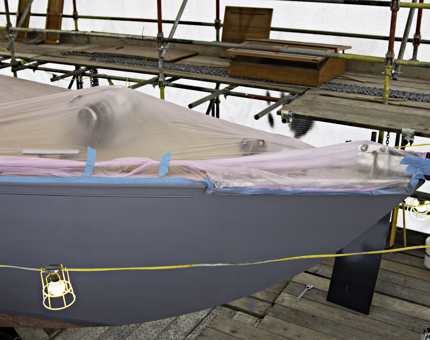 Deck of Bloodhound is covered over and hull shows an undercoat has been applied. 