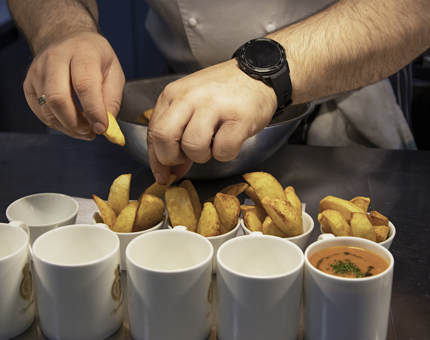 Chef readies potato wedges for serving in the Tea Room.