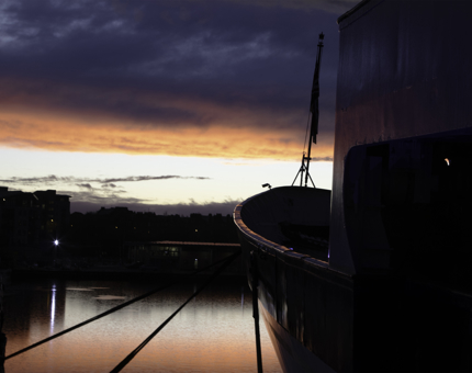A pink and blue sunset from the bow of The Royal Yacht Britannia.