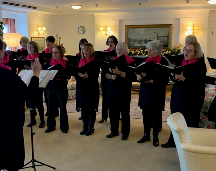 Choir group of ladies singing in Britannia's State Drawing Room. 