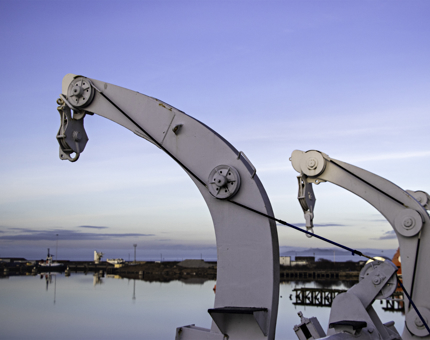 Two large arm shaped hangers on Britannia's outside deck. 