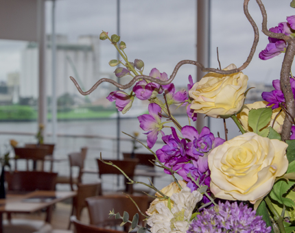 A pastel coloured fresh flower display arranged on the piano in the Royal Deck Tea Room. 