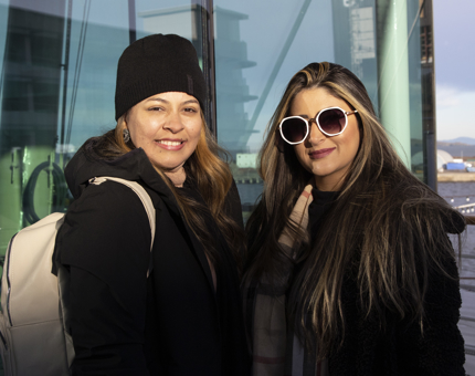 Two women visitors pose outside The Royal Deck Tea Room. 