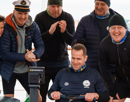 Former Scotland rugby captain Chris Paterson rowing flat out cheered on by his team, Nichol's Nautical Eight.