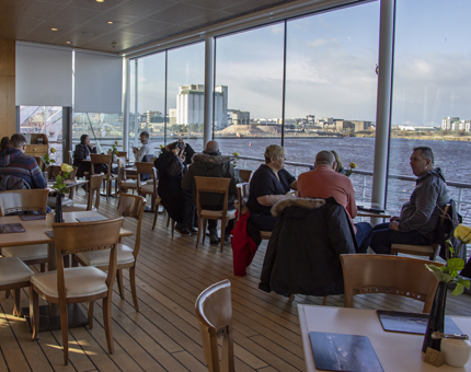 The view inside Britannia's Royal Deck Tea Room with a beautiful sea view out over the Firth of Forth. 