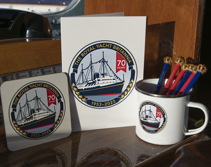 A selection of 70th anniversary gifts celebrating Britannia: a drinks coaster, greetings card and mug. 