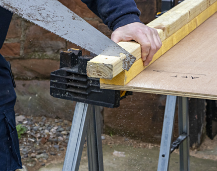 A close-up of the wood sawing. 