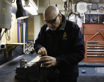 A member of the Maintenance team making up connectors for the Fresh Water Pipework on Bloodhound.