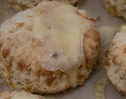 A close-up of a cheese scone.