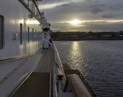 The sun sets on the starboard side of Britannia.