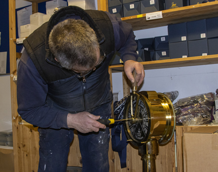 A Maintenance man fixing the telegraph in the Gift Shop display. 