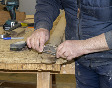 Gary shaping the end of the handrail.