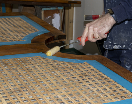 A closer look at the varnish being applied.