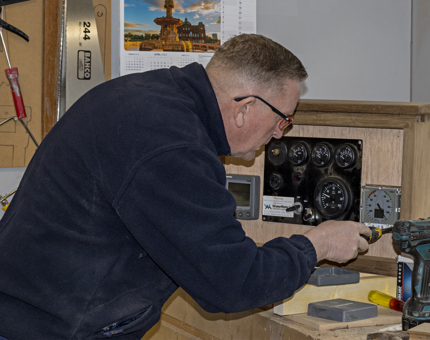 Mark working on the new control box, prior to fitting aboard Bloodhound.