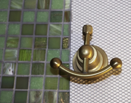 Aboard Fingal, each bathroom is full of nautical brass details.