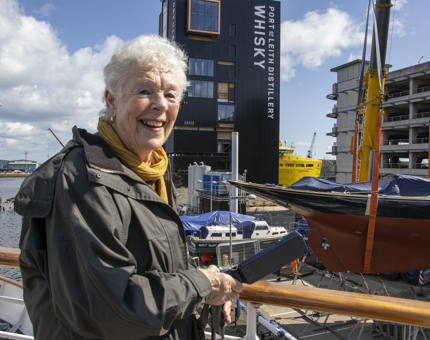 Visitors watching former Royal racing yacht Bloodhound returning to the water