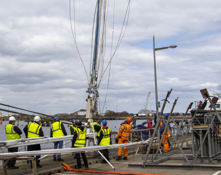 Members of the Maintenance team stepping Bloodhound's mast.