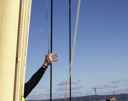 Tony catching the other end at the base of the mast.