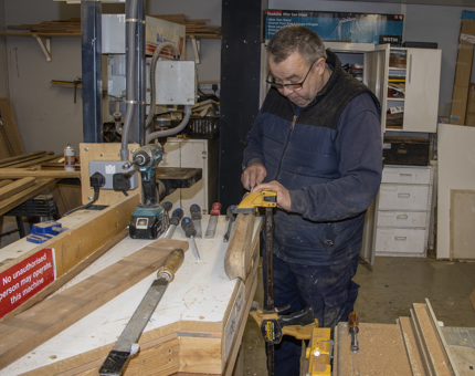 A man working in the workshop. 