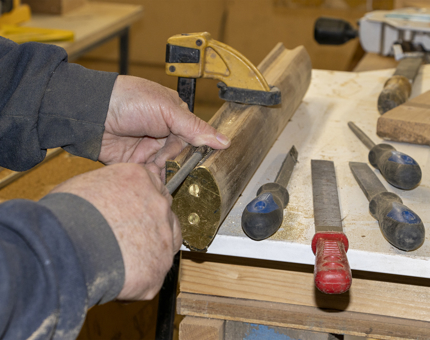 A selection of tools on a workbench in the workshop.