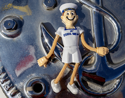 A dangling Yottie character fridge magnet. 