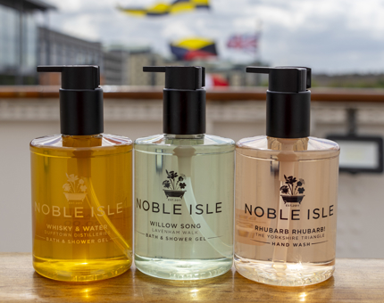 Three Noble Isle bath and shower products: Whisky and Water, Willow Song and Rhubarb Rhubarb. 
